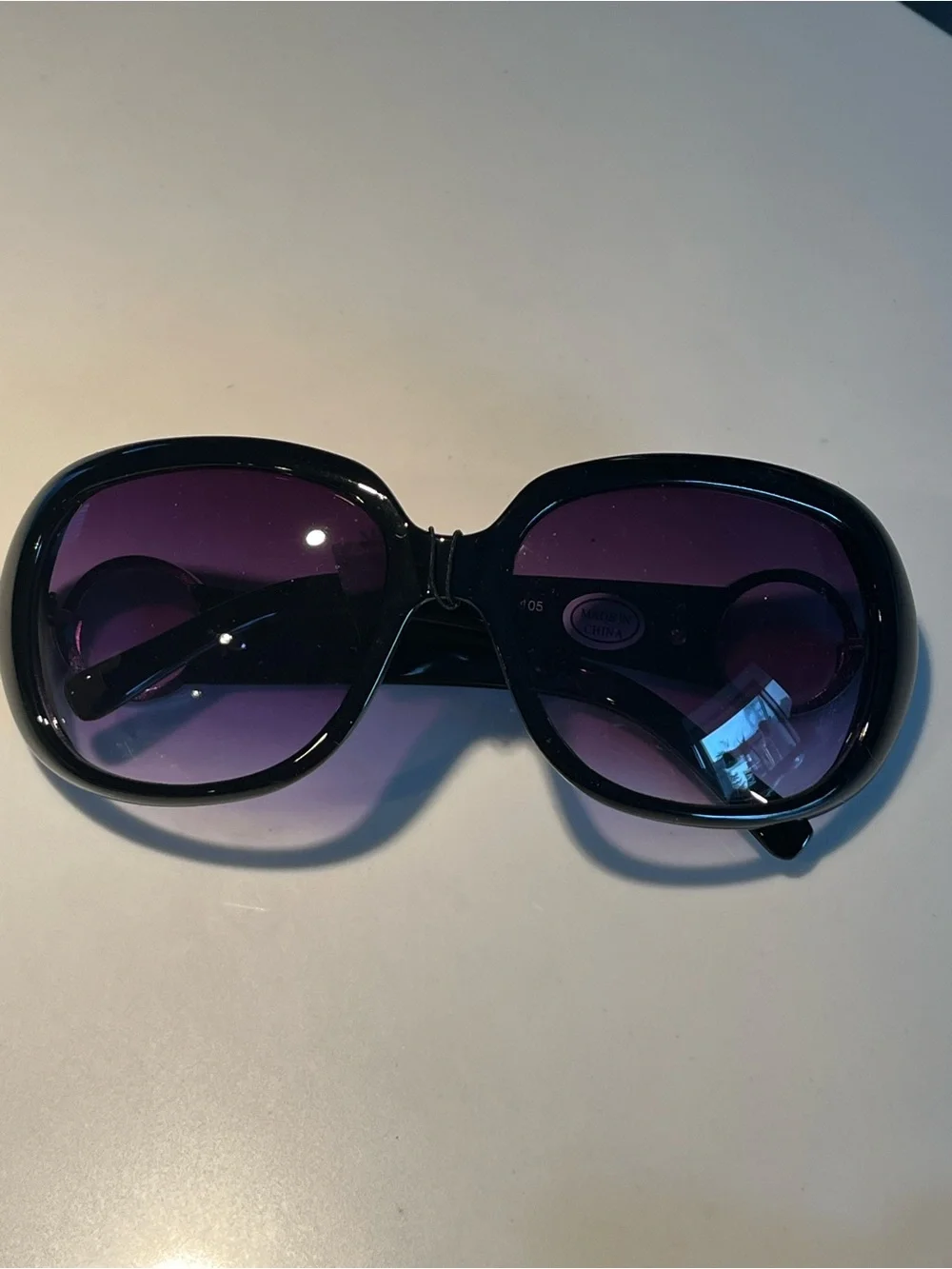 NWT fabulous oversized black sunglasses with violet lenses.